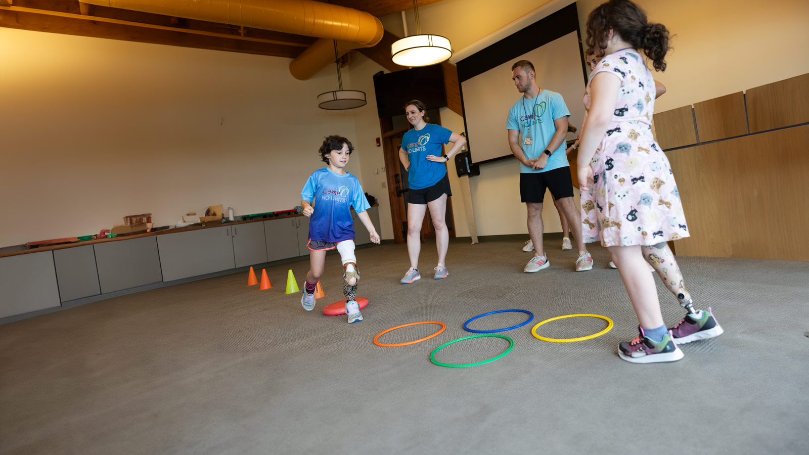 School of Health Sciences students work with kids during Camp No Limits.