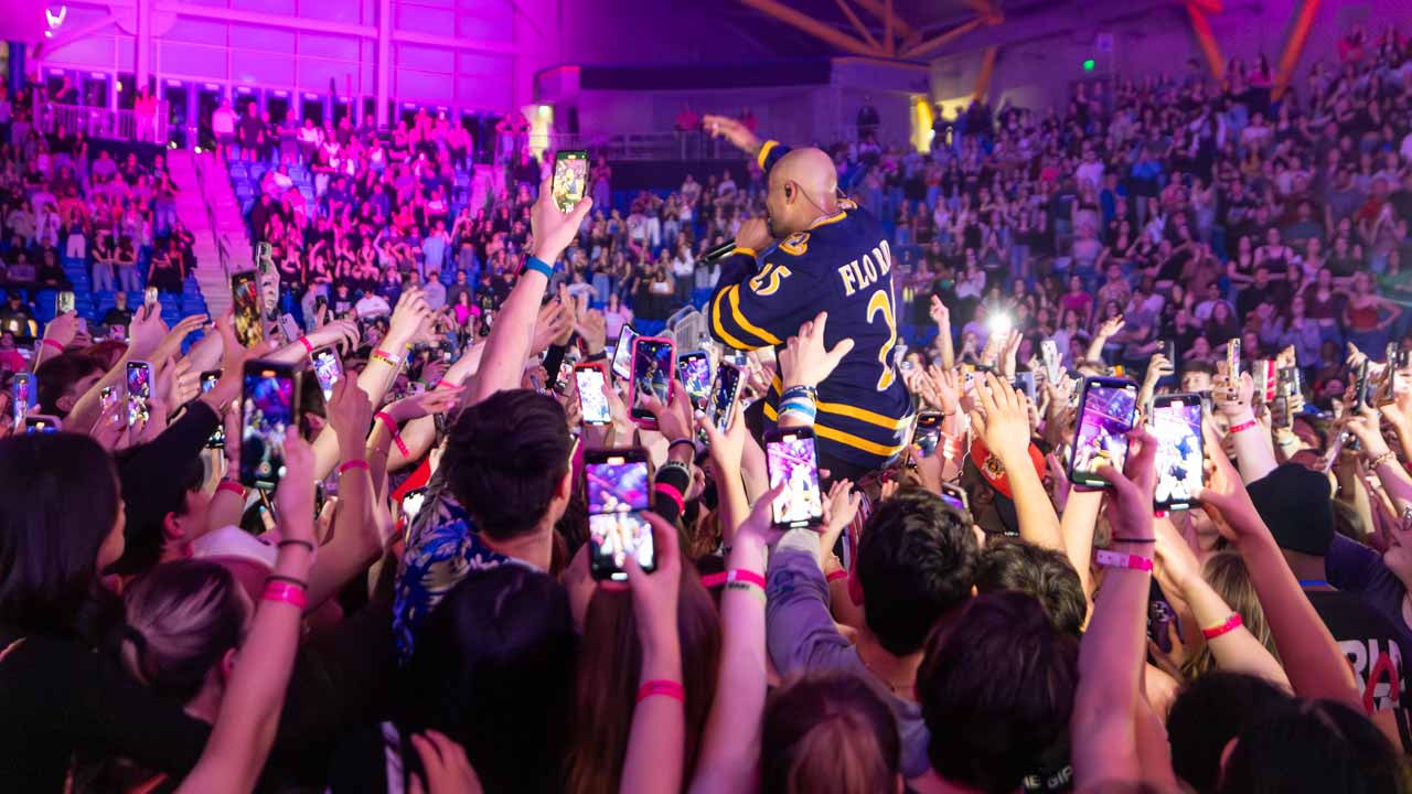 Flo Rida crowd surfs through the Quinnipiac students on the floor of the M&T Bank Arena