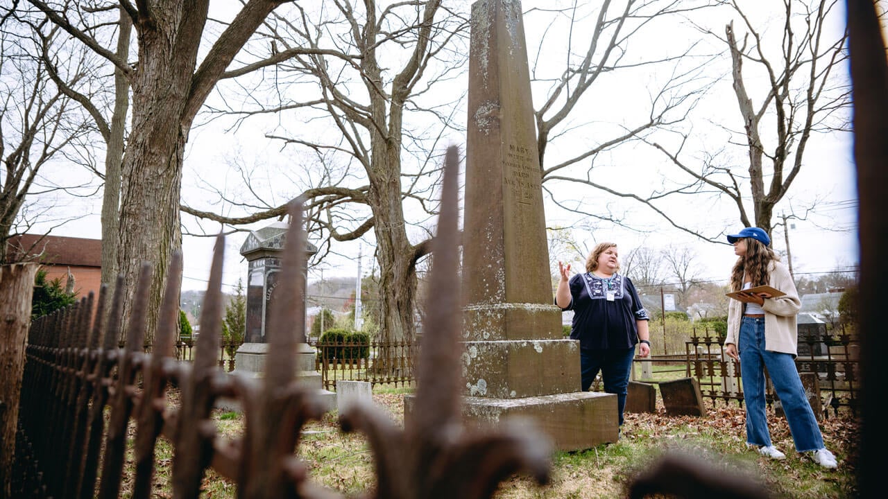 Students take notes at local cemetery for their data analysis