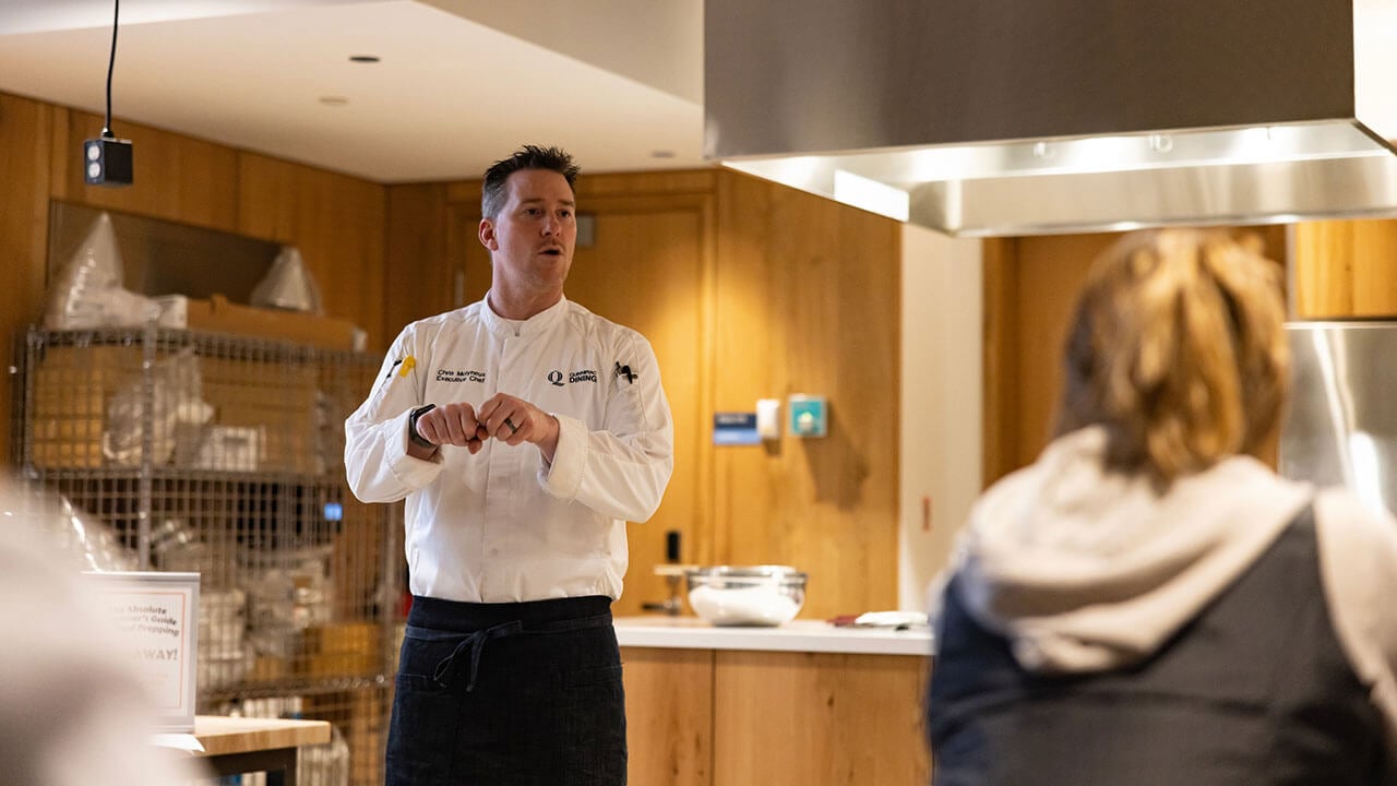 Campus Executive Chef Chris Molyneux speaks to the students in the teaching kitchen