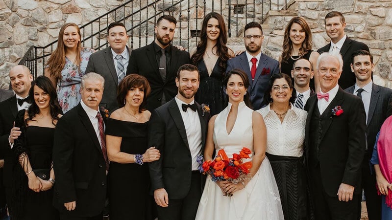 Elizabeth Moran and Michael Bivona smile with guests at their wedding