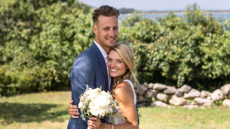 Kaleigh Quinn and Wyatt Hamilton embrace on their wedding day