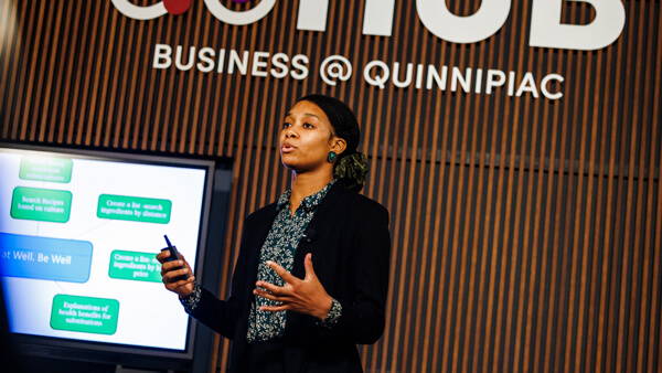 Business student presents in the School of Business Innovation Hub.