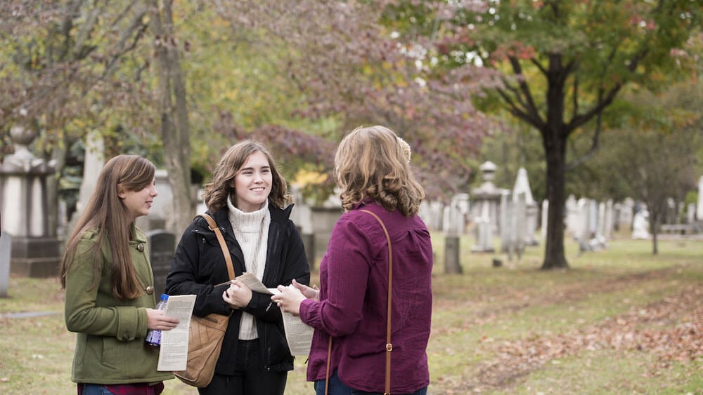Quinnipiac University Honors students Jenna Sucato, a first-year student, English major in the MAT program, Emily Greene, a junior, engineering major, and Cassidy Healey, a junior, biomedical sciences major, from left, tour Grove Street Cemetery in New Haven as part of the honors program's New Haven trips