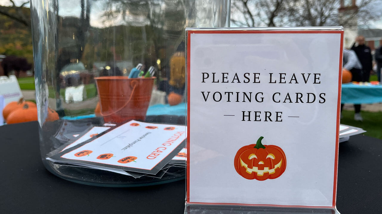 Please leave your voting cards here sign and card collection jar
